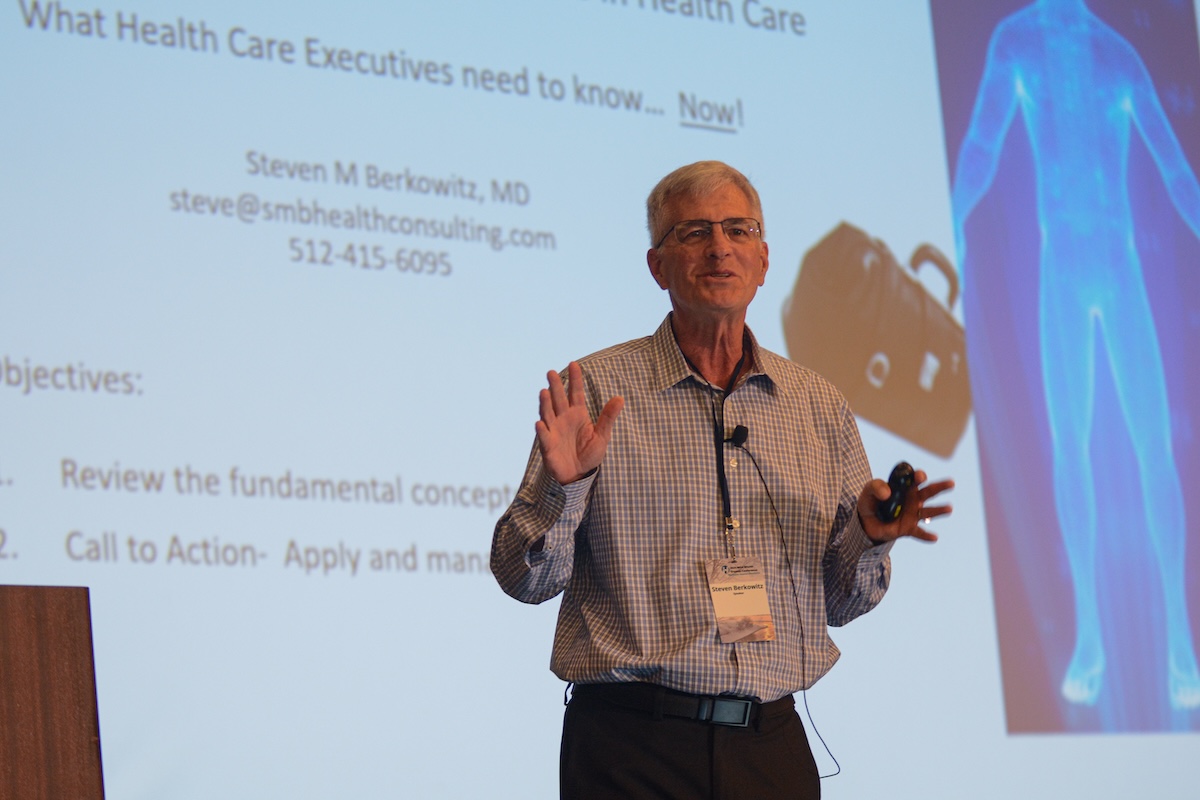 behavior scientist Michael I Norton delivering a TED Talk