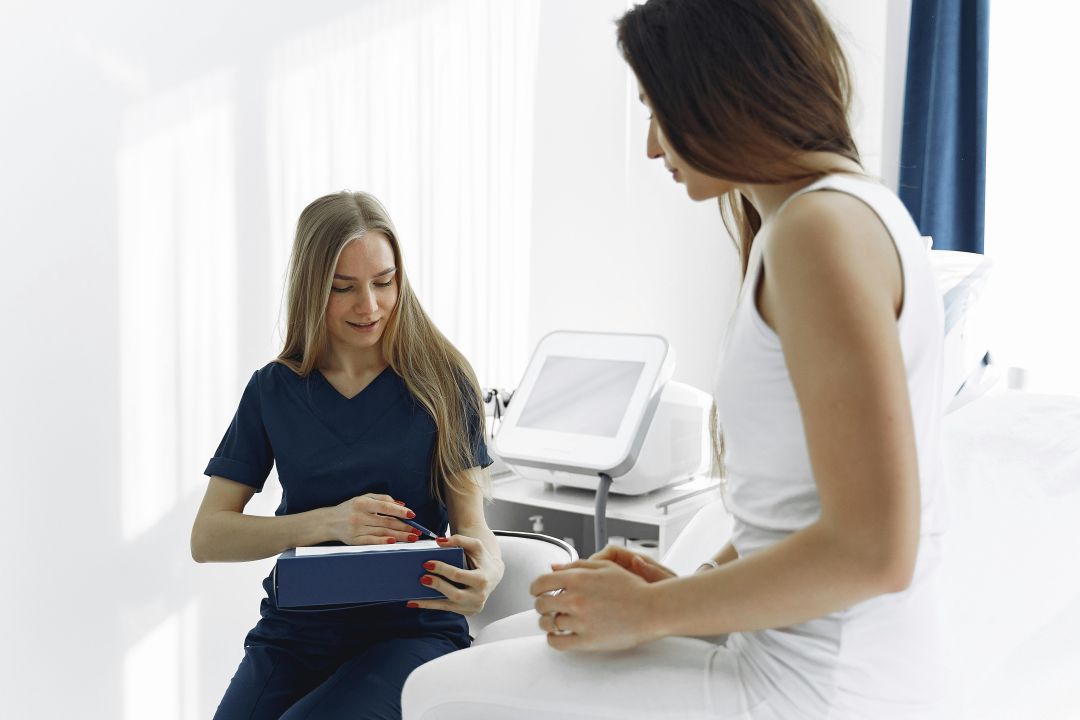 a primary care doctor speak with a patient aided by AI